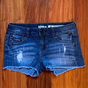 Distressed juniors denim shorts.
